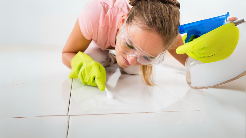 woman applying non-abrasive cleaner on the shower tile floors